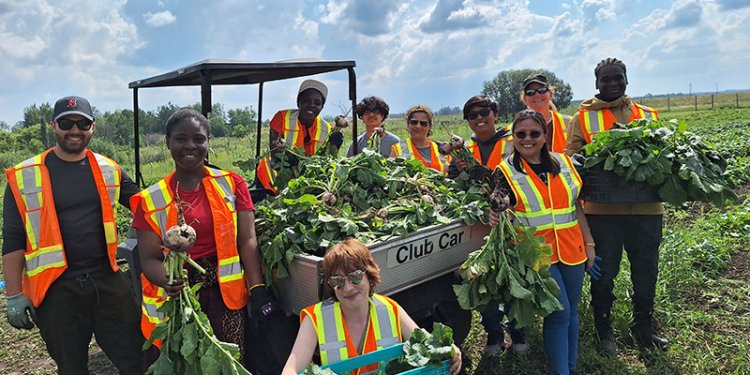 diverse group of friends at farm with products