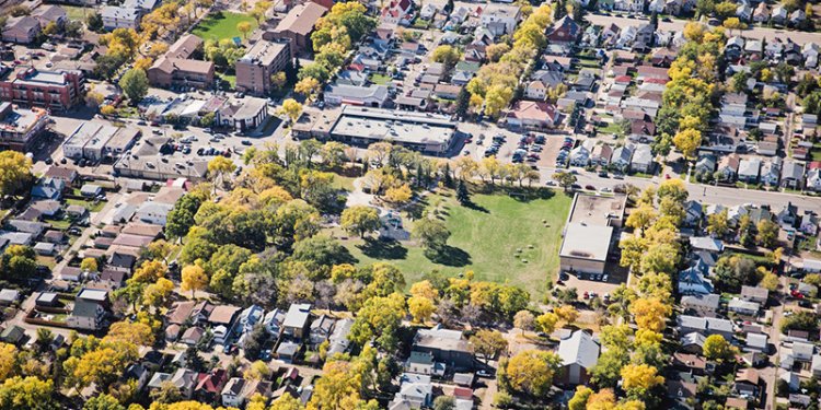 aerial view of community with houses and trees