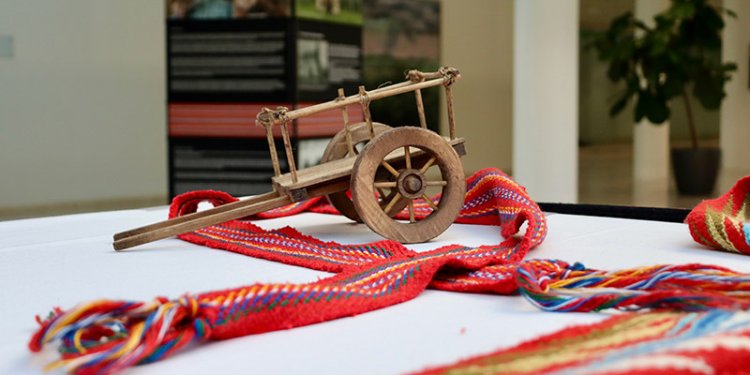 red river cart on tablecloth