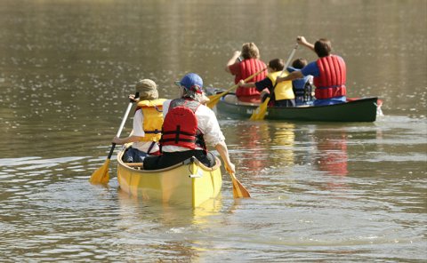 people in boat on river