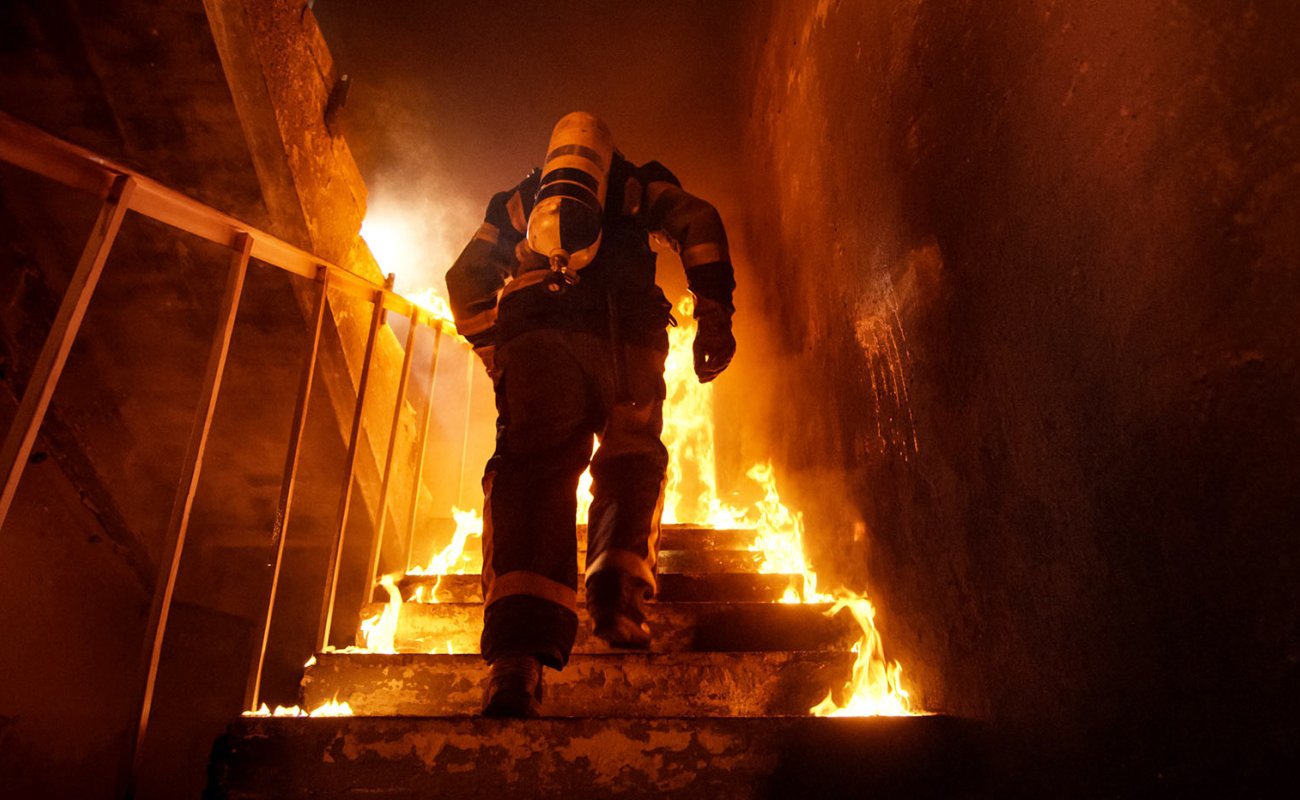 Firefighter climbing stairs