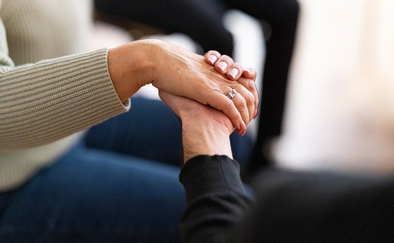 hand holding other hand