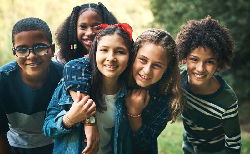 diverse youth huddled together