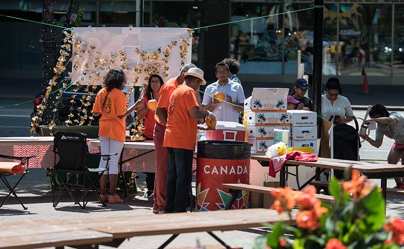 people standing at booth