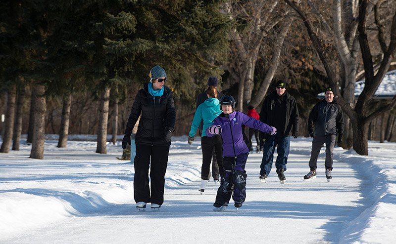 people skating on iceway
