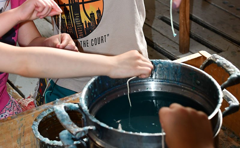 kids making wax candles