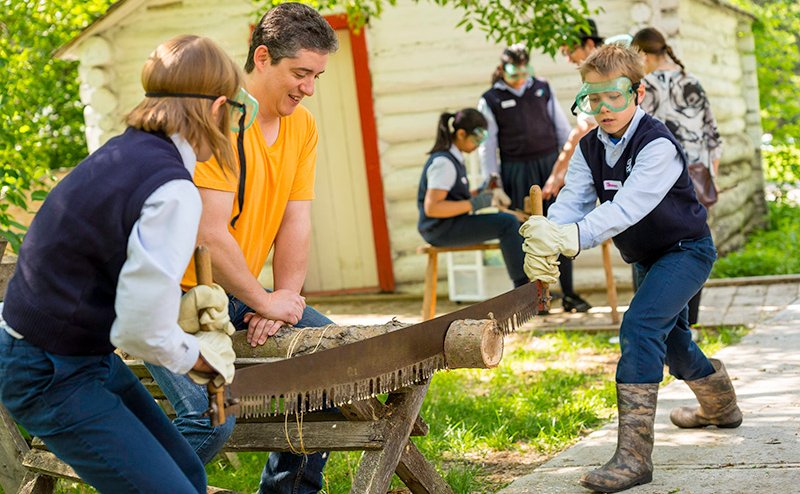 kids using old time saw
