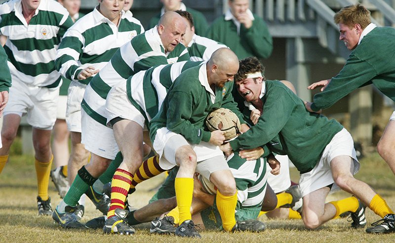 rugby players tackling each other