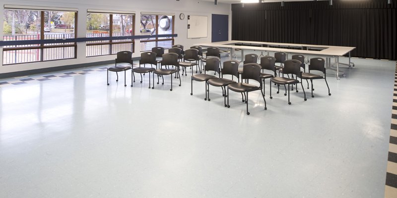 large room with chairs and wide windows