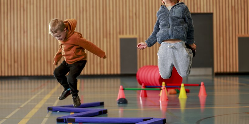 children jumping inside a gym