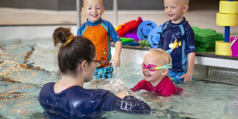 swim teacher with children