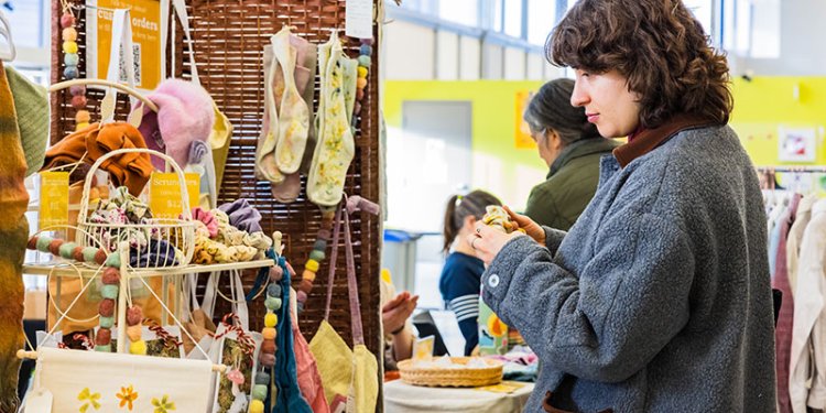 person-standing-at-vendor-craft-stall