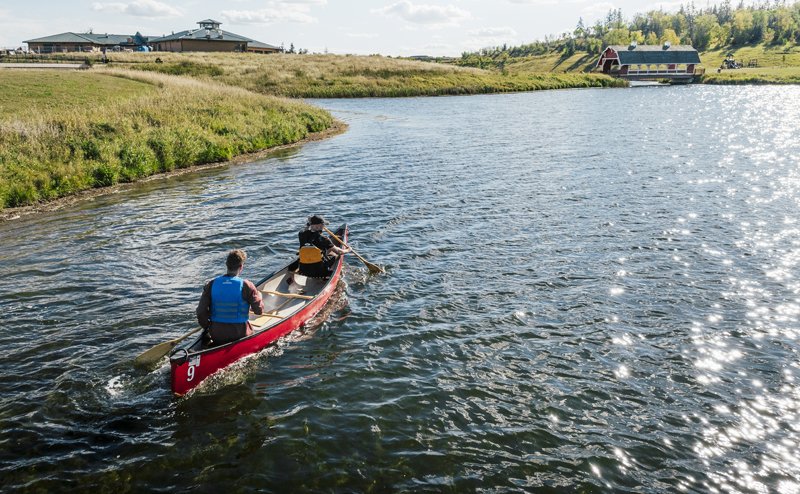 Two people kayaking on a lake